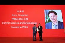 Prof Song Yongduan, Dean of the School of Data Science and Henry Y. W. Fong Chair Professor of Industrial Data Science at Lingnan University (left), receives his member plaque as an International Member of the Chinese Academy of Engineering in Beijing. 