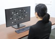 Image of OMU experiment conducted: Participant estimates how many dots are shown on a screen.