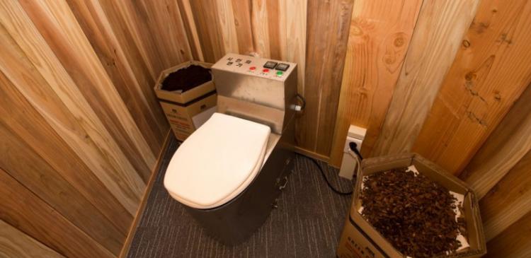 Waterless energy-producing toilet system