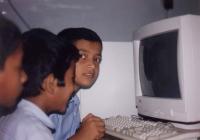 Kids learning computers at school. 