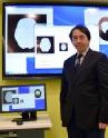 Dr Fuk-hay Tang with CAD stroke system