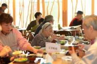 Older adults have a meal in a community in Sakai, Japan