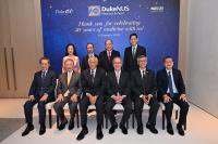 A group of people posing for a photo at a gala event.