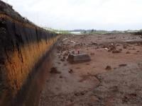Exposing the “disaster-scape” in Kyushu. The yellow band in the soil is the “disaster layer” of compacted ash. The layer was found during the excavation of the Aihara No1 site, 150km to the north of the K-Ah epicenter (September 2020). It is about 70 cm thick and would have been about 1.5 to 2.0 meters meters when the event first happened. (Photo: Junzo Uchiyama, the first author of the paper)