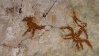 photograph of the rock art panel with the two hand stencils 