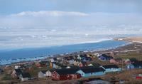 Qaanaaq Village in July 2018. The ocean is still covered in sea ice