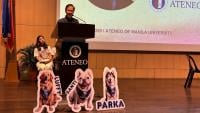 “Research, at its best, is an act of service,” said Ateneo de Manila University Assistant Vice President for Research, Creative Work, and Innovation Dr. FIlomeno Aguilar Jr at the Second Philippine Human-Animal Bond Conference, as Communitails co-founder Dr. Camille Asuncion looks on. With them, front and center, are standees representing just some of Communitails’ many beloved therapy dogs—“therapy dogtors” in their own right. PHOTO: Ateneo de Manila University.