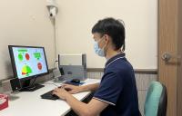 Lingnan University study shows that multitasking uses multiple cognitive abilities. A research assistant looks at the tasks used in the study.  