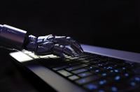 robot hand on keyboard